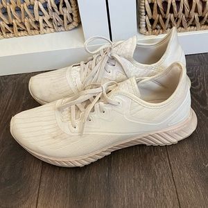 Reebok cream and pink sneakers